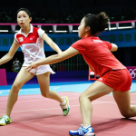 **Image Prompt 1:** A dynamic action shot of badminton players competing in an Olympic match. Emphasize speed, agility, and strategic play, with a focus on a powerful smash. Capture the intensity and excitement of the game.